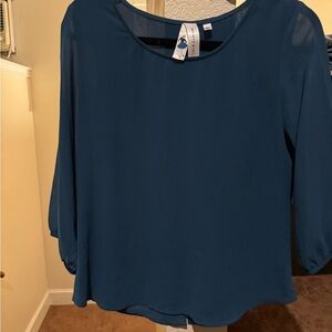 Women’s dress top with buttons and slit in back